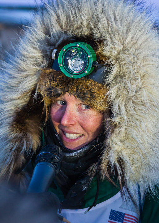 Paige at the finish line of the Iditarod in 2013 sporting her Scurion. Photo by Scott Chesney